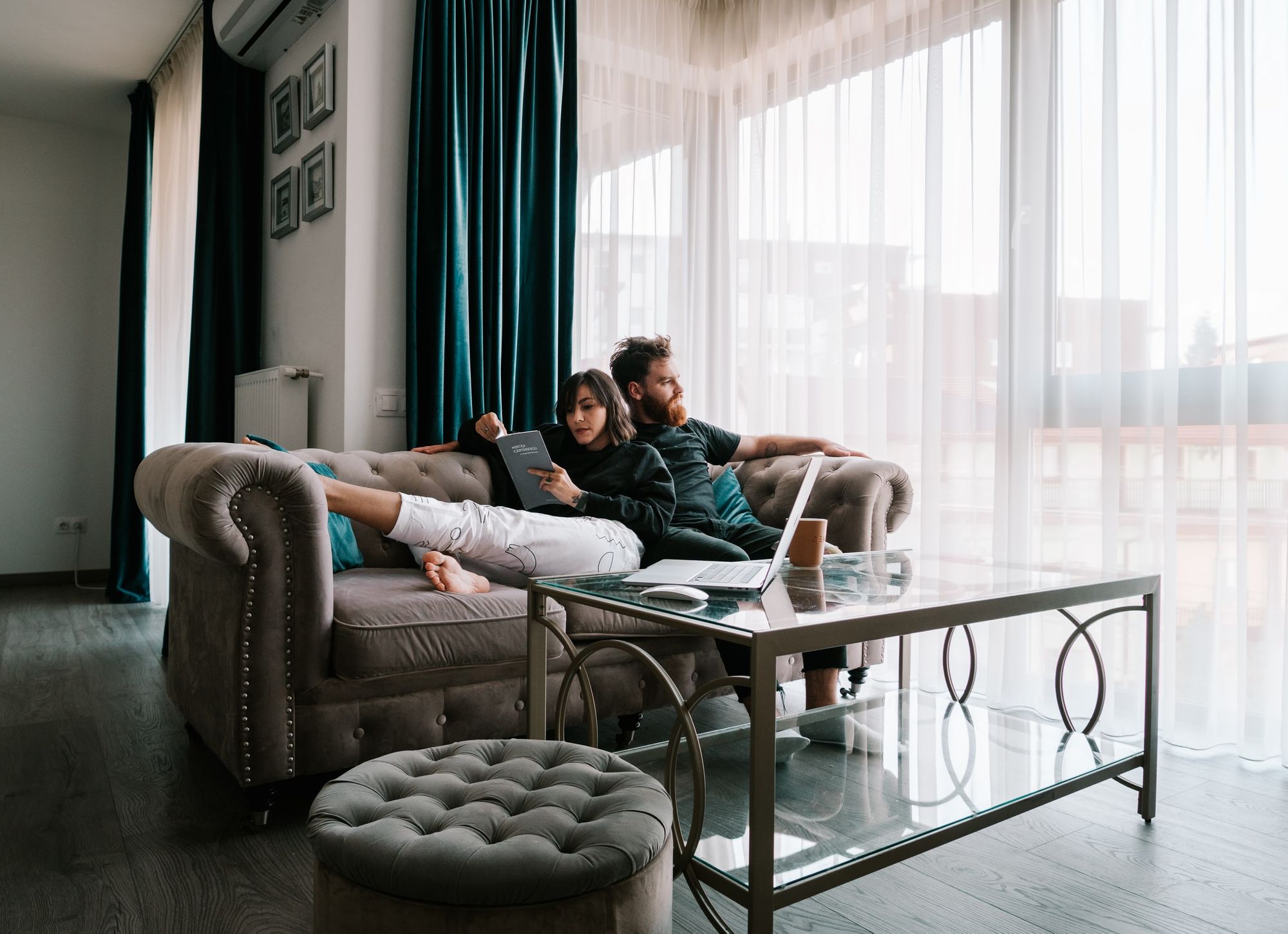 Couple relaxing together on a sofa in their living room